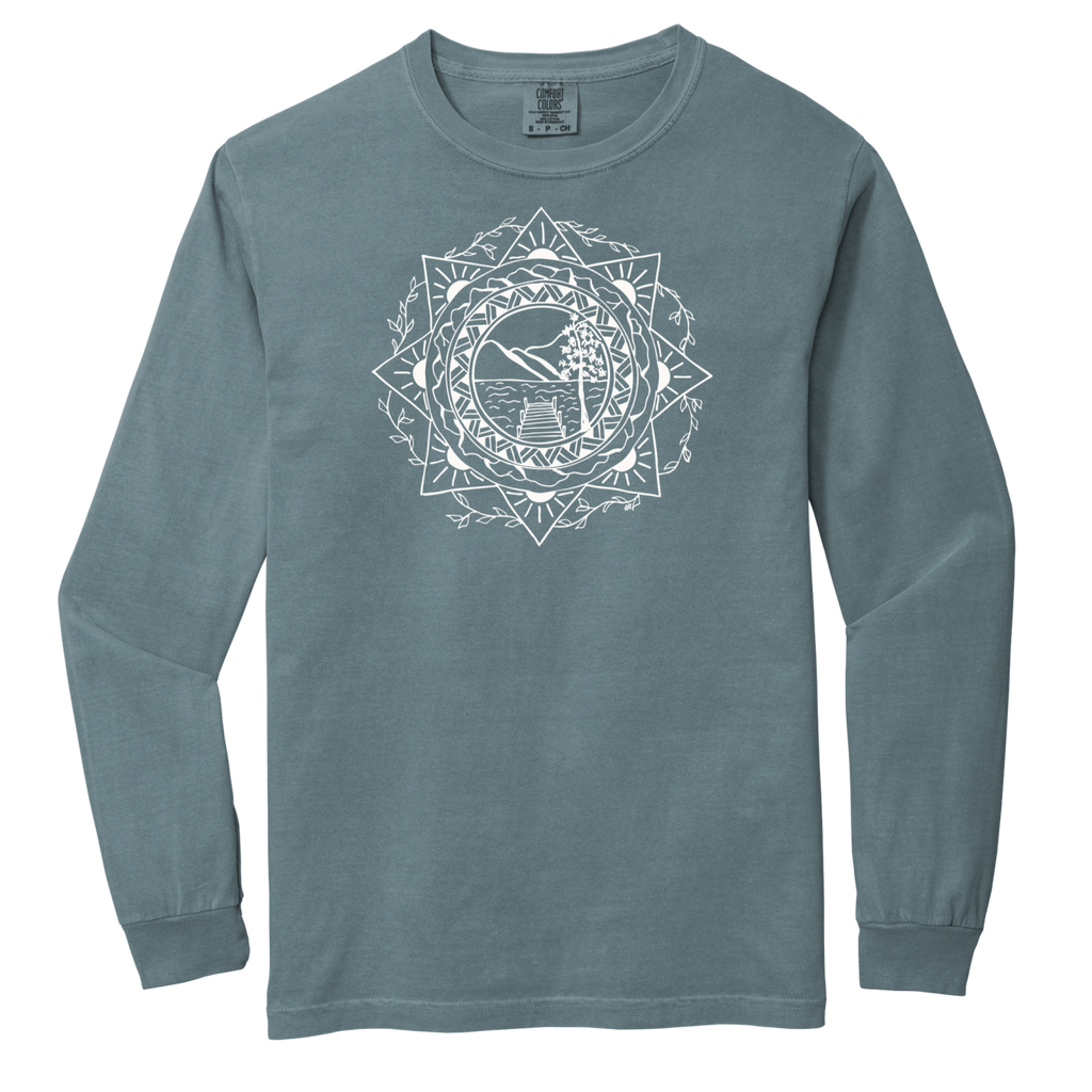 Blue long-sleeve shirt with a white geometric design on a white background