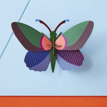 Load image into Gallery viewer, Product Image : Acacia Butterfly wall decoration assembled and on a blue background