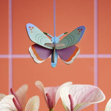 Load image into Gallery viewer, product photo  butterfly ornament hanging above flowers