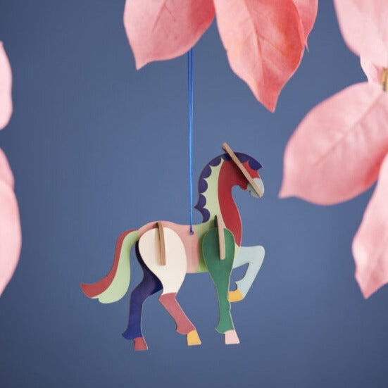 product photo:  horse ornament hanging from branch