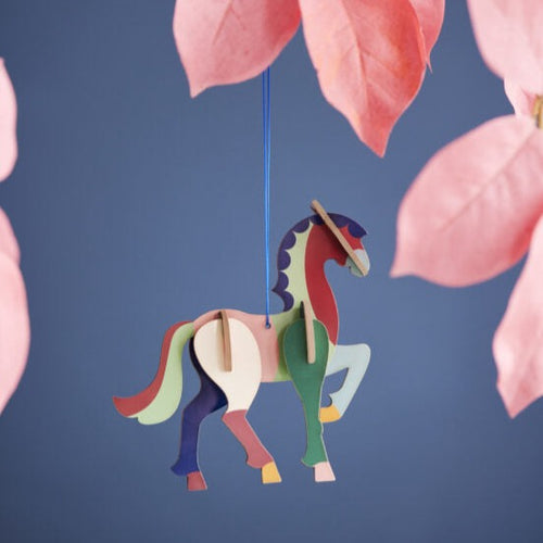 product photo:  horse ornament hanging from branch