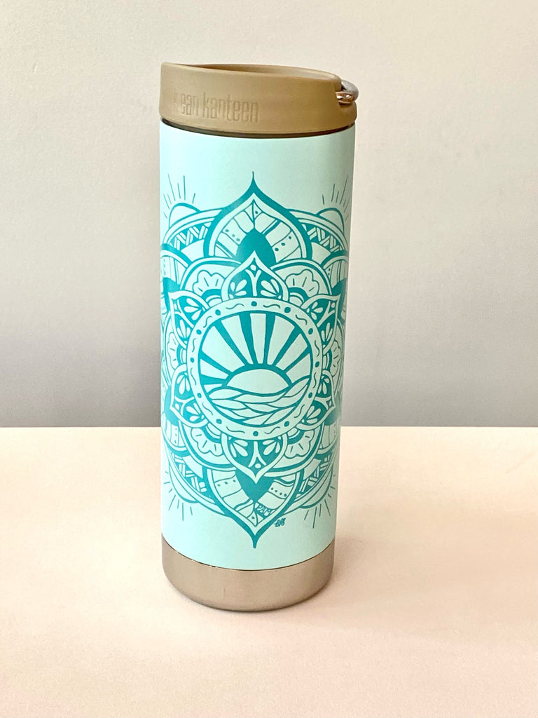 product Image: Front View - matte blue tint Insulated coffee cup with darker blue sun mandala design and a taupe lid