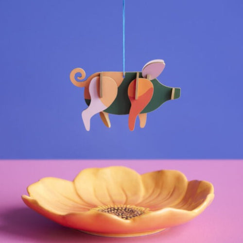 Product photo - pig ornament hanging over flower dish