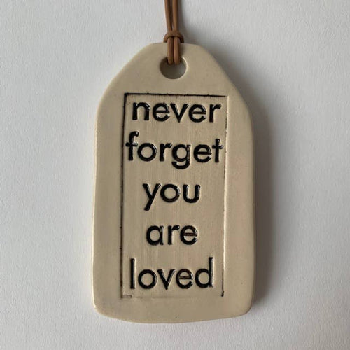 Ceramic Quote Tag: never forget (provides 7 meals)