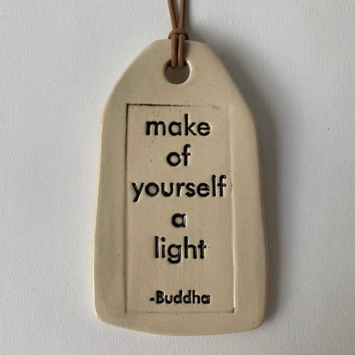 Ceramic Quote Tag: make of yourself a light (provides 7 meals)