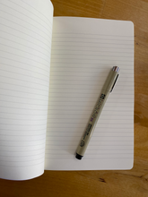 Load image into Gallery viewer, product photo:  the open notebook showing lined paper and pen