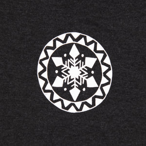 Close up of the white snowflake mandala design on grey