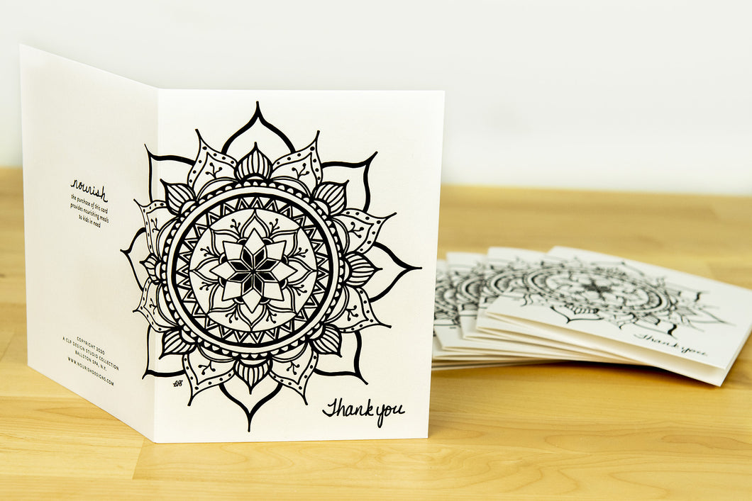 Product Image : Thank You note card propped up with stack of note cards behind it slightly out of focus. 